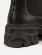apawwa Botine izolați cu talpă joasă (tip chelsea) cu bieżnik Stephos Negre