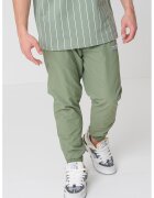 Karl Kani Pantaloni de trening relaxed fit Sport Patch Essential - Verde aquamarin/Alb murdar