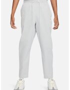 Nike Pantaloni conici de trening Club Alumni - Gri deschis