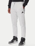 adidas Pantaloni trening Essentials Feelcozy Fleece JE3819 Regular Fit