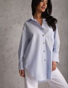 bisou's project Cămașă albastră supradimensionată din bumbac cu nasturi eleganți Rhenenore