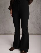 by swan Pantaloni flare modelatori din tricot din bumbac Tirena Negri