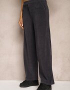 little supermodel Pantaloni largi bleumarin decorați cu imitație de buzunare Tassae
