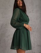 retro & icone Rochie evazată verde cu inserții semi-transparente și guler tip tunică Gelabine