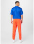 ADIDAS SPORTSWEAR Pantaloni sport 'Essentials Warm-Up Tapered 3-Stripes' roșu orange / alb - Pled.ro