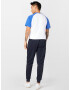 ELLESSE Pantaloni sport 'BERTONI' bleumarin / portocaliu / roșu / alb - Pled.ro