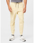 Nike Sportswear Pantaloni galben pastel - Pled.ro