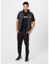 Nike Sportswear Pantaloni 'AIR' negru / alb - Pled.ro