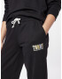 Tommy Jeans Pantaloni albastru / portocaliu / negru / alb murdar - Pled.ro