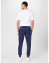 Tommy Jeans Pantaloni bleumarin / roșu / alb - Pled.ro