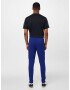 UNDER ARMOUR Pantaloni sport albastru închis / alb - Pled.ro