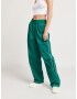 UNFOLLOWED x ABOUT YOU Pantaloni 'ESCAPE PANTS' verde - Pled.ro