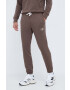 New Balance pantaloni de trening culoarea maro neted - Pled.ro