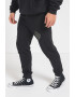 Converse Pantaloni de trening cu croiala conica si logo - Pled.ro