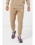 Nike Pantaloni de trening cu buzunare laterale - Pled.ro