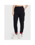 Tommy Hilfiger Pantaloni trening Global Stripe S10S101511 Bleumarin Relaxed Fit - Pled.ro