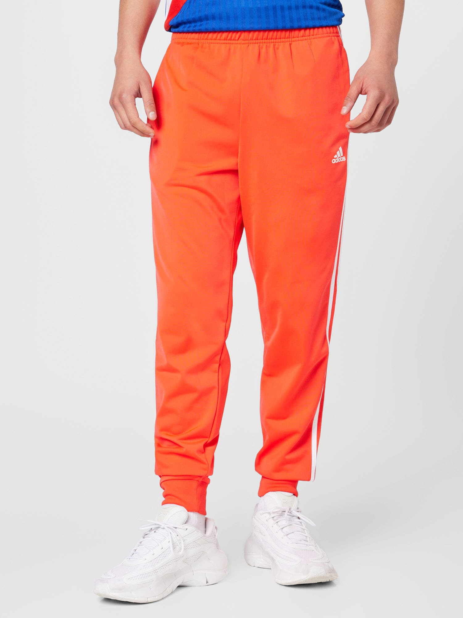 ADIDAS SPORTSWEAR Pantaloni sport 'Essentials Warm-Up Tapered 3-Stripes' roșu orange / alb - Pled.ro