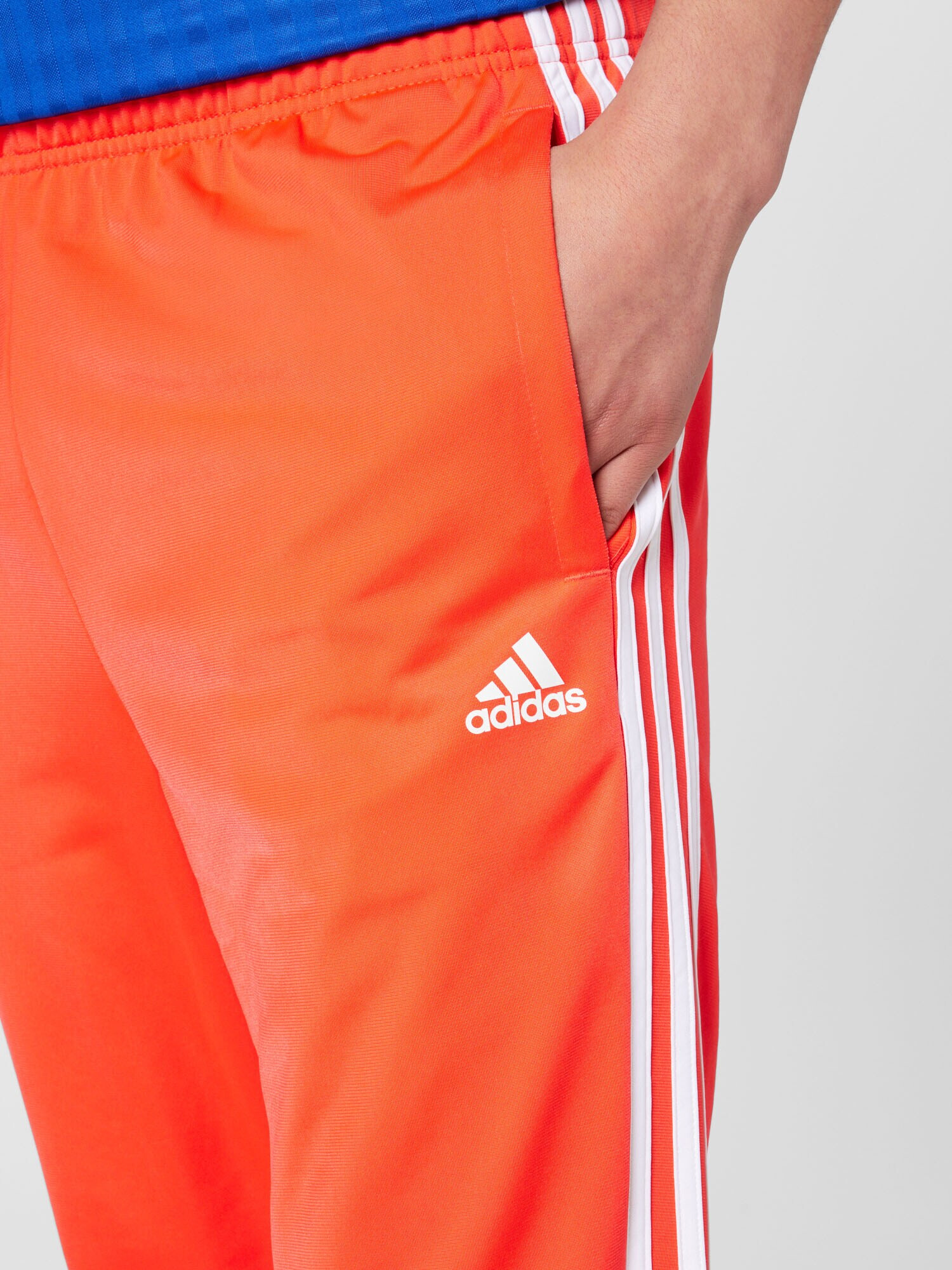 ADIDAS SPORTSWEAR Pantaloni sport 'Essentials Warm-Up Tapered 3-Stripes' roșu orange / alb - Pled.ro