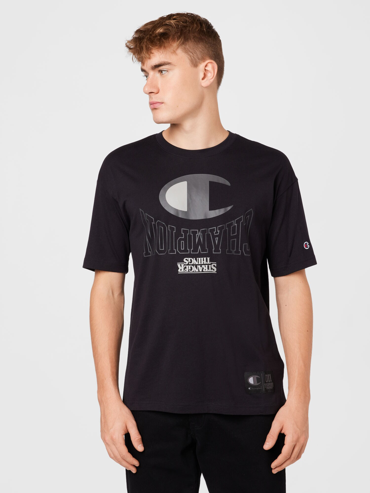 Champion Authentic Athletic Apparel Tricou 'X Stranger Things' gri / negru / alb - Pled.ro