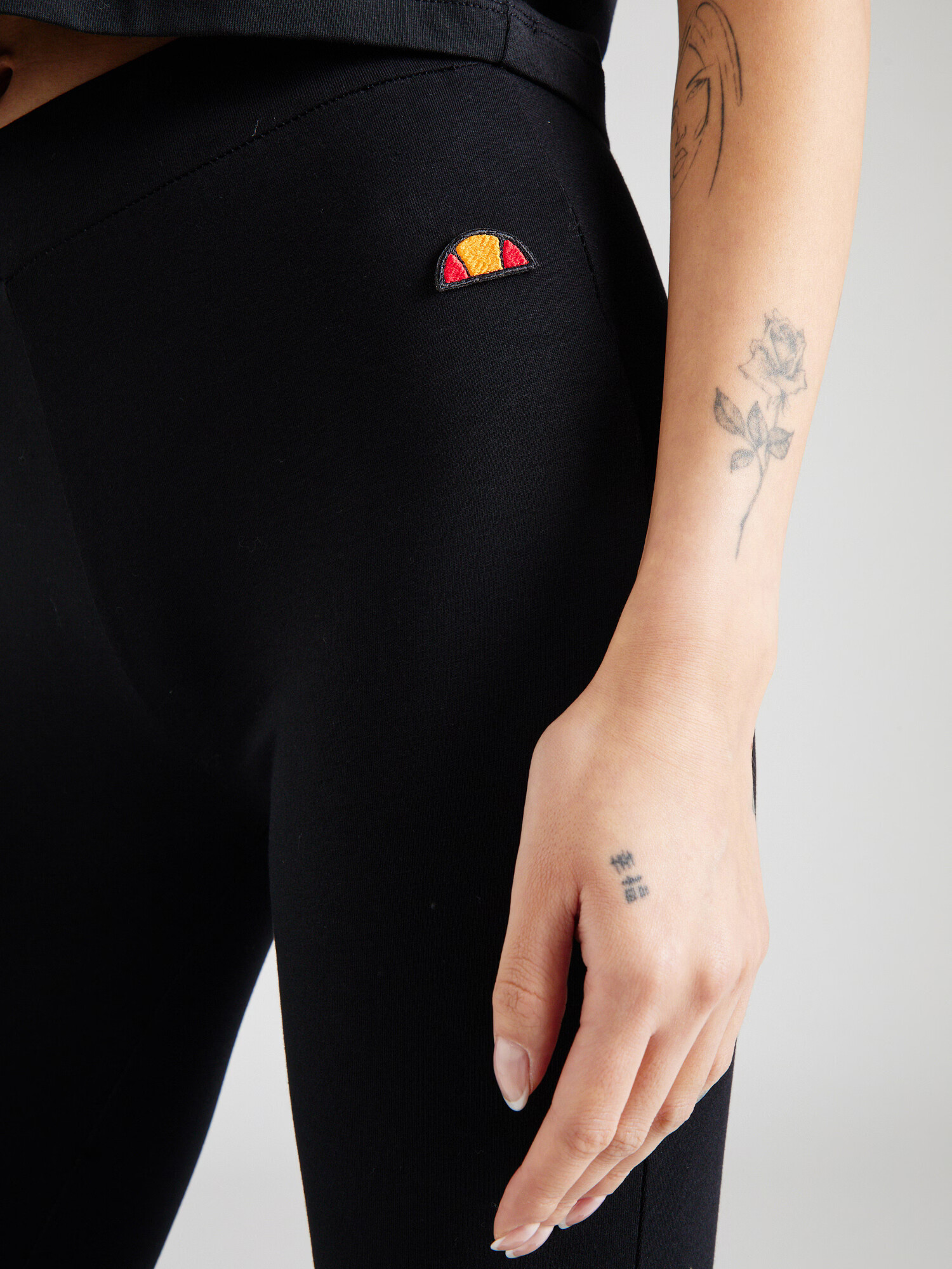 ELLESSE Leggings 'Debora' portocaliu / roșu / negru - Pled.ro