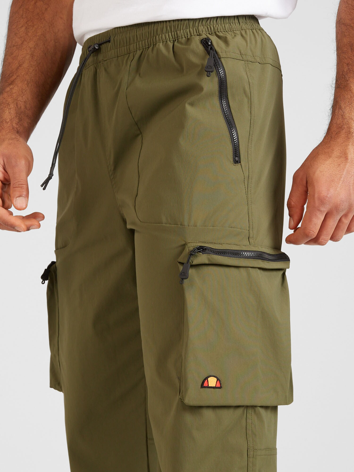 ELLESSE Pantaloni cu buzunare 'Squadron' kaki - Pled.ro