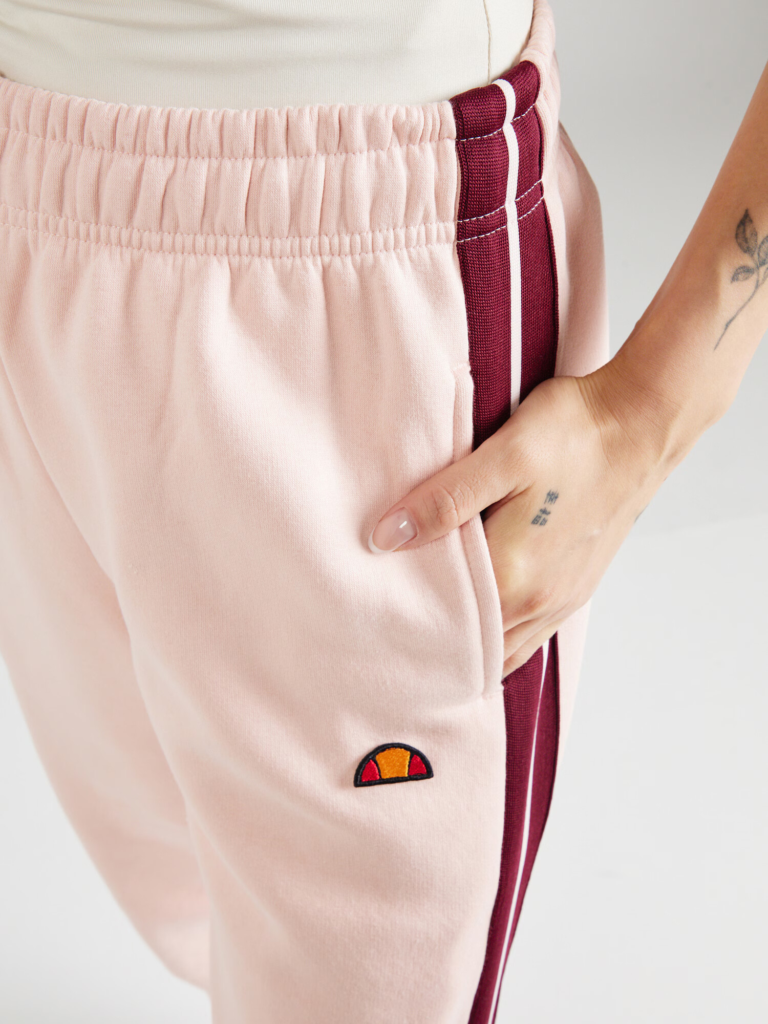 ELLESSE Pantaloni 'Radice' roz pastel / roșu carmin - Pled.ro