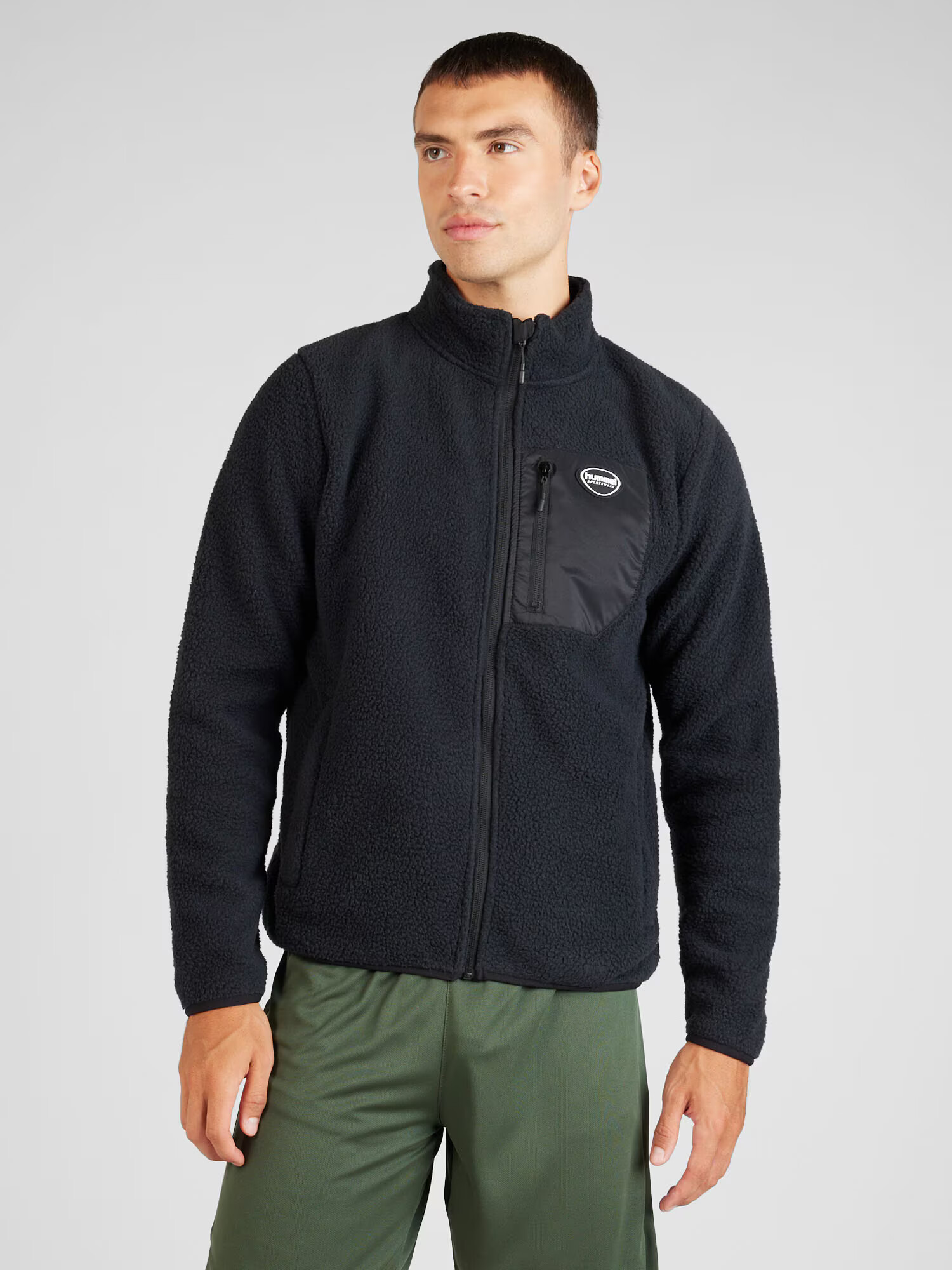 Hummel Jachetă fleece 'LGC OLIVER' roz pal / negru / alb - Pled.ro