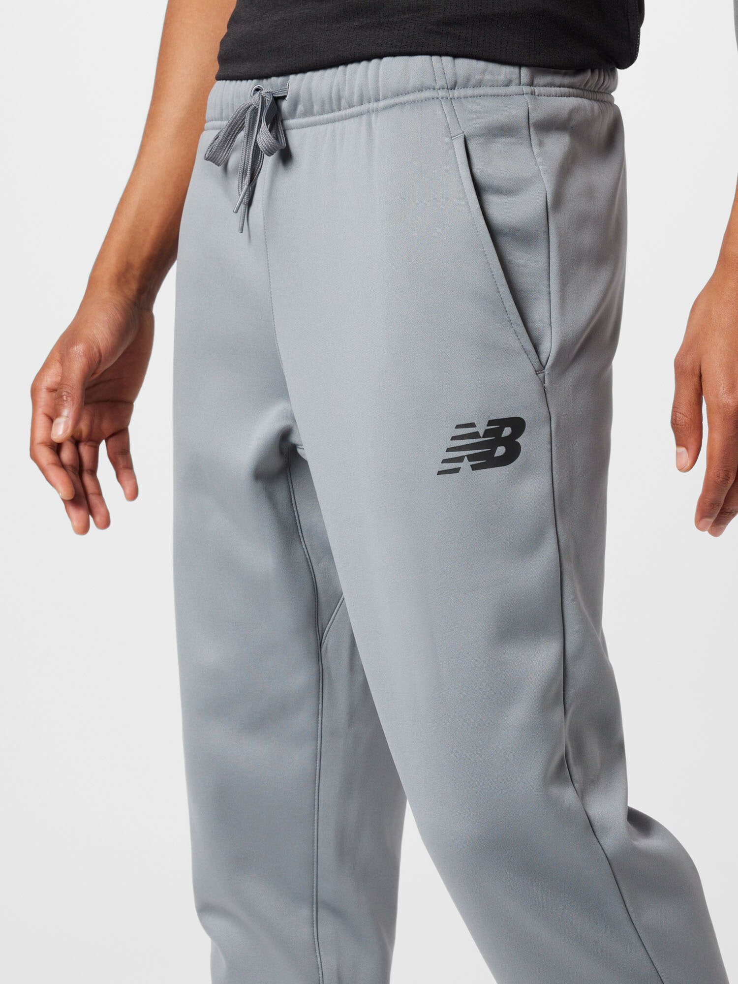 new balance Pantaloni sport 'Tenacity' gri / negru - Pled.ro