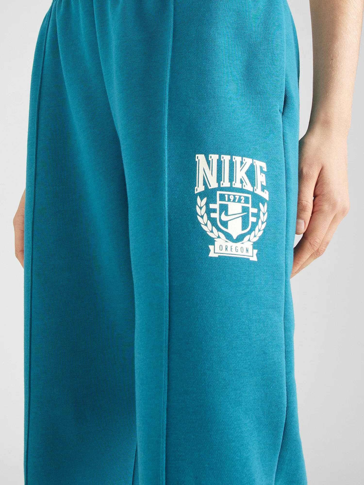 Nike Sportswear Pantaloni verde petrol / alb - Pled.ro