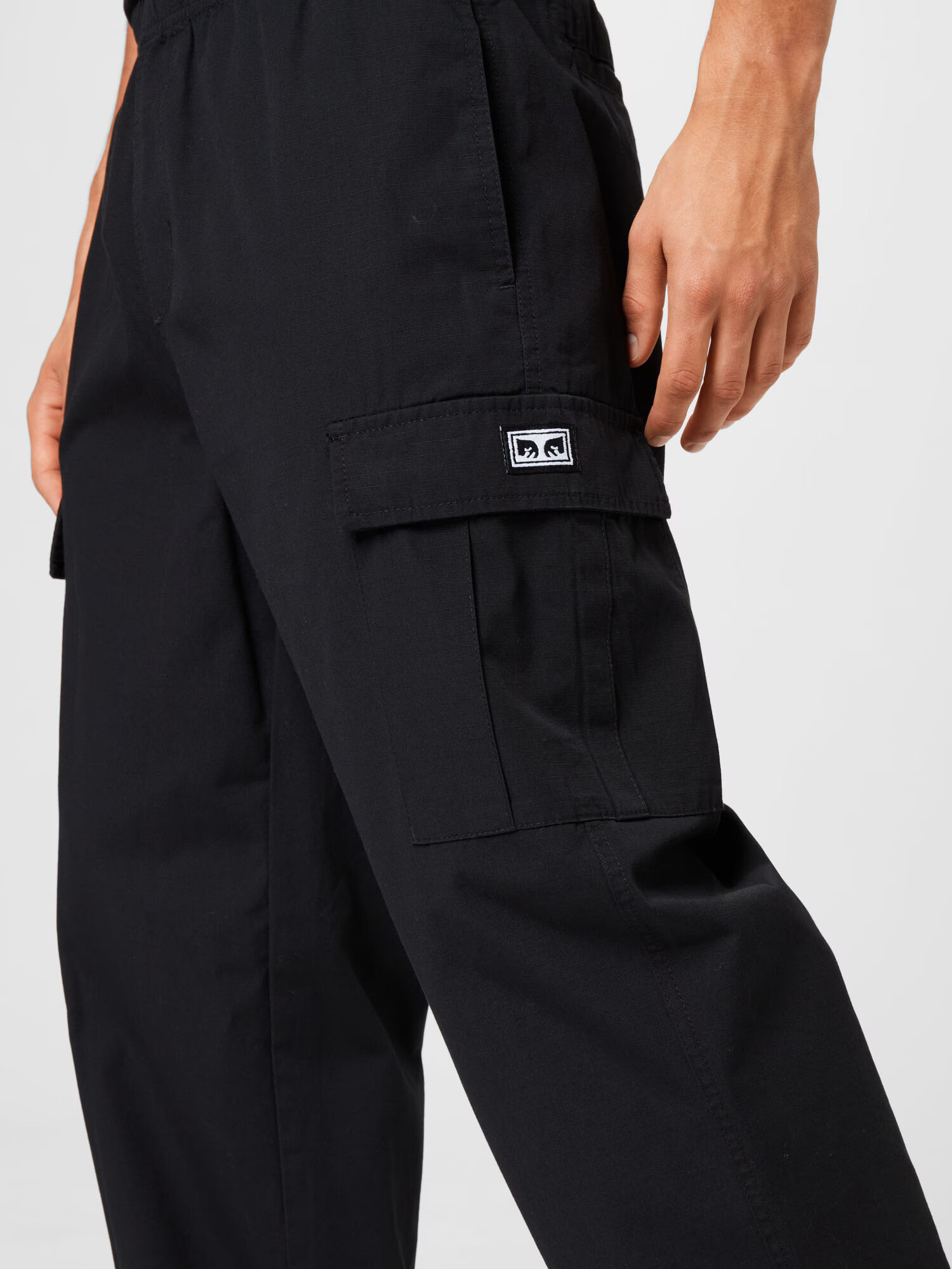 Obey Pantaloni cu buzunare negru / alb - Pled.ro