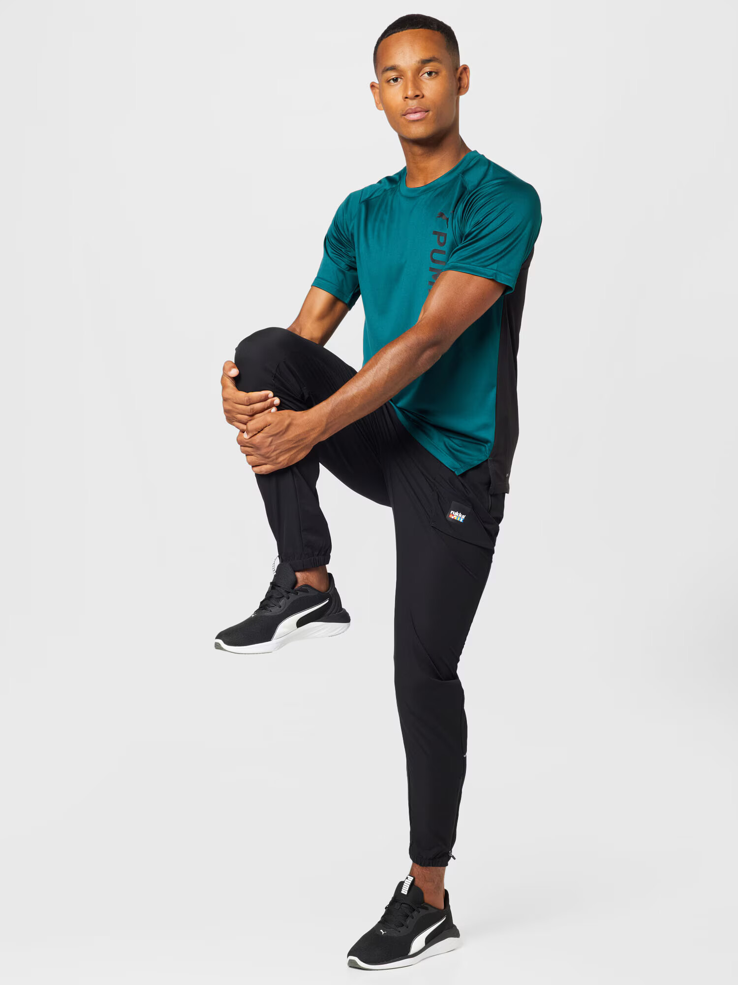 PUMA Tricou funcțional verde smarald / negru - Pled.ro