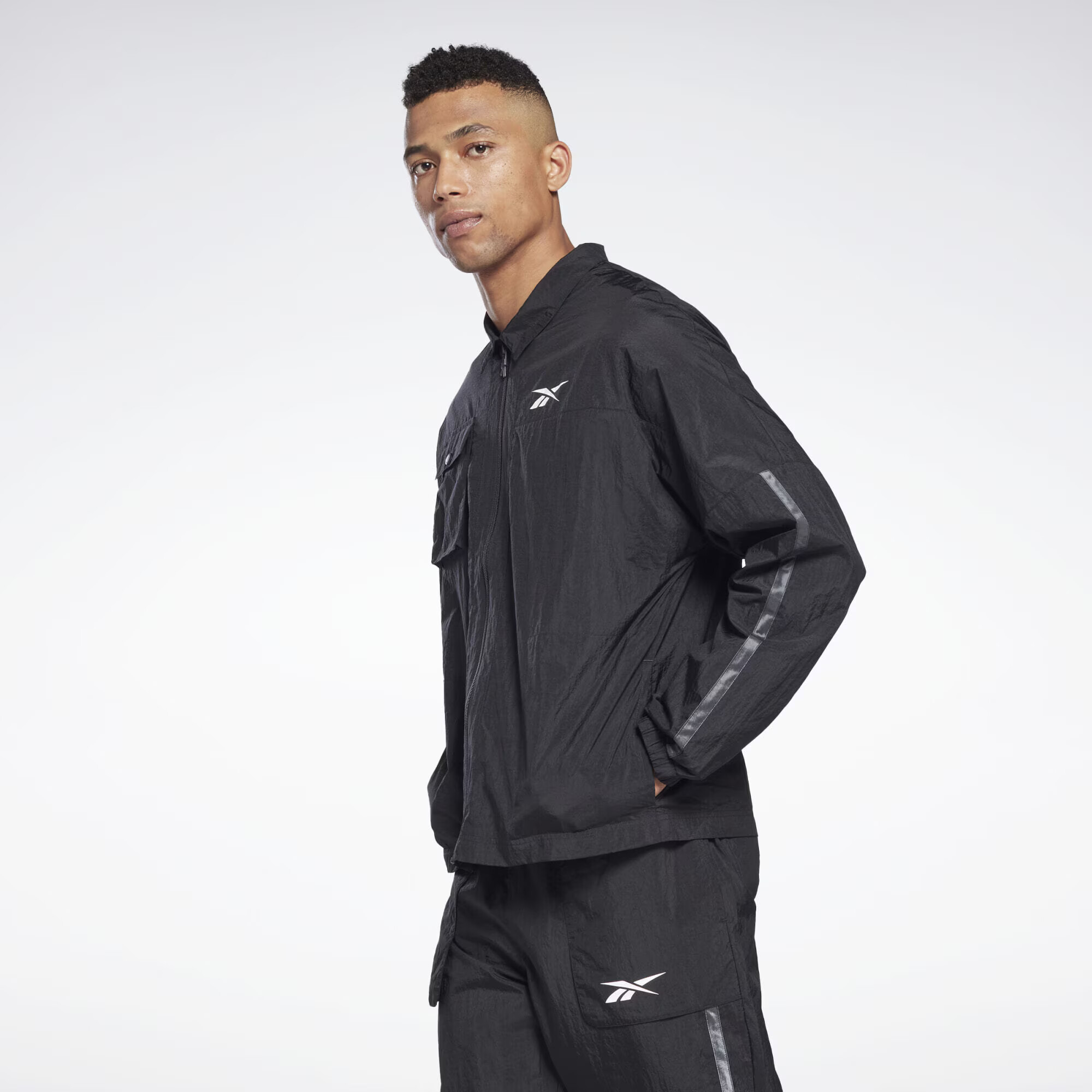 Reebok Sport Geacă sport gri / negru / alb - Pled.ro