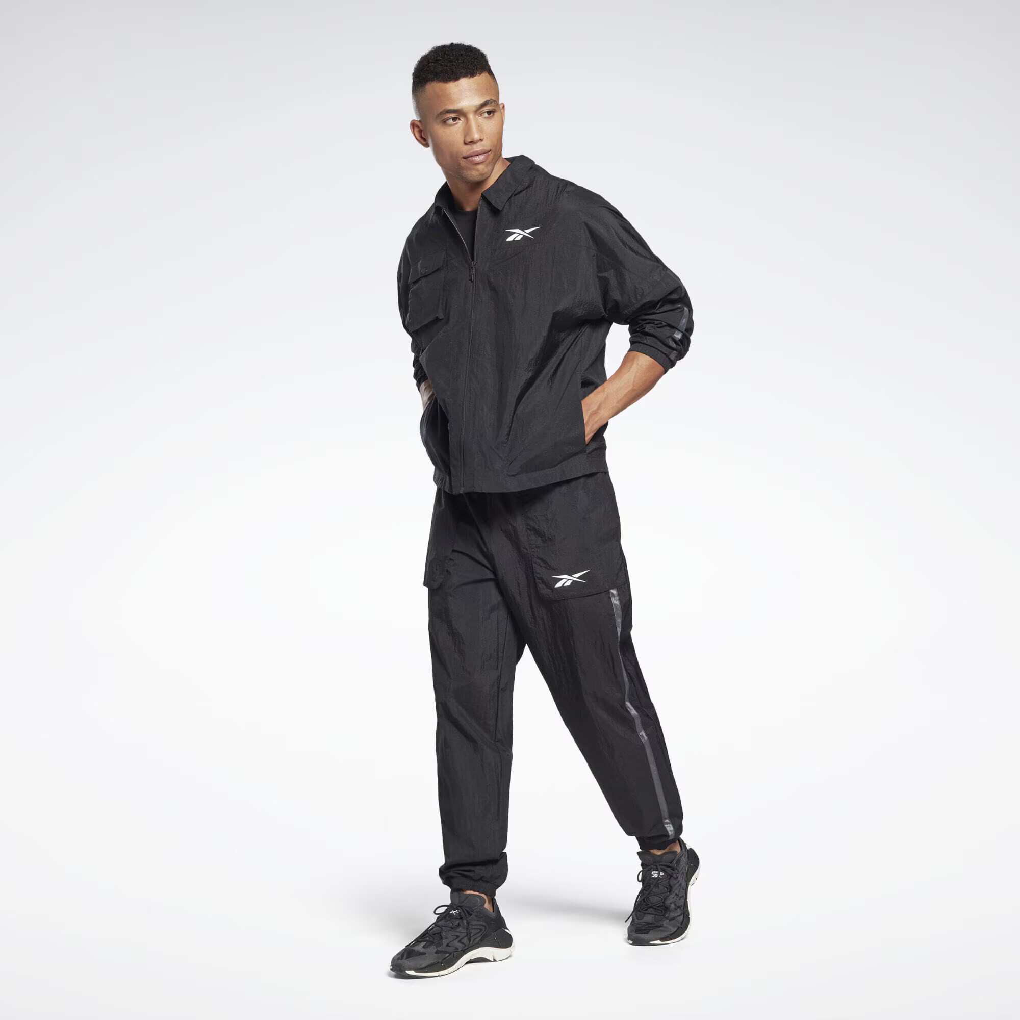 Reebok Sport Geacă sport gri / negru / alb - Pled.ro