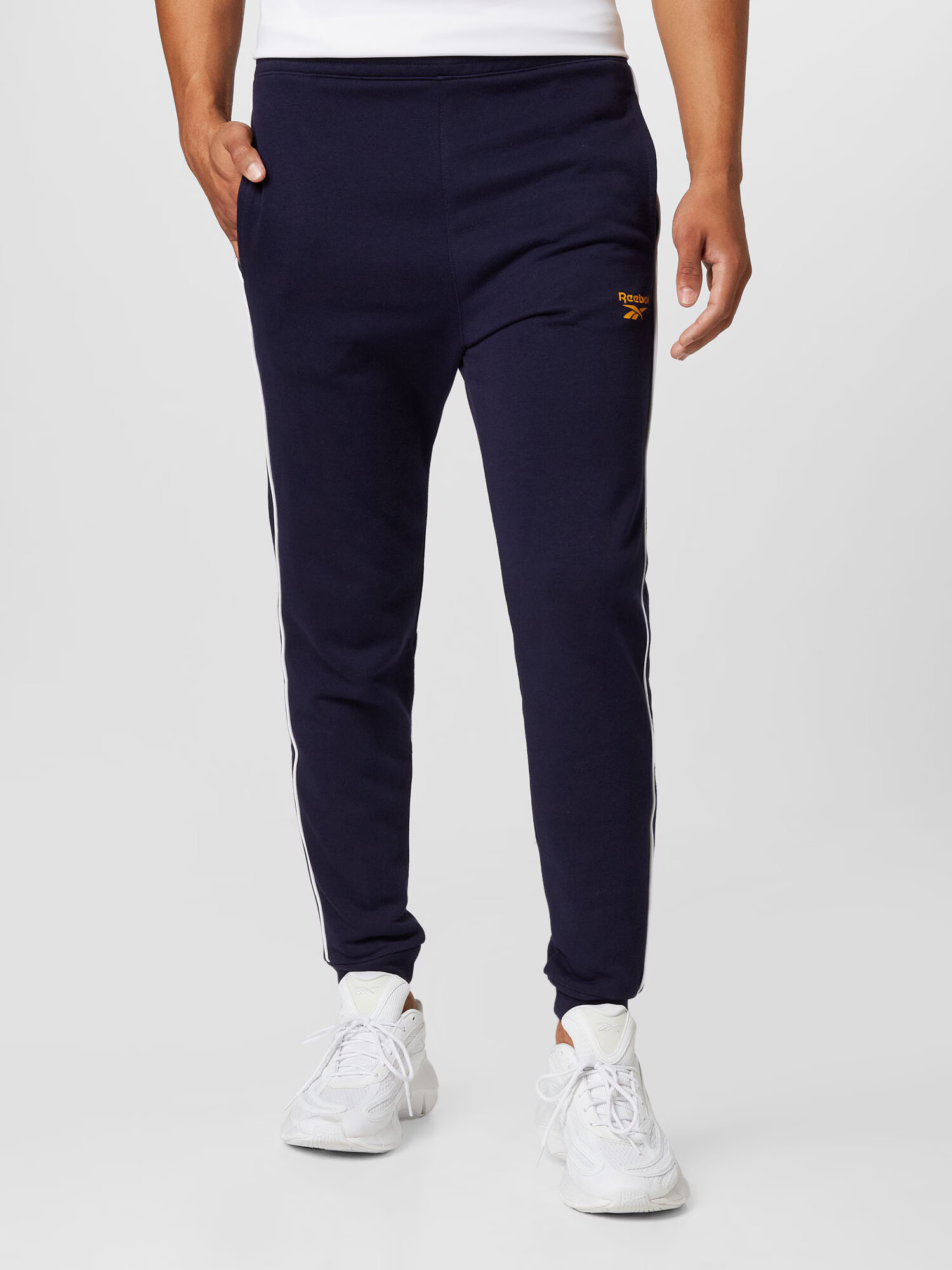 Reebok Sport Pantaloni sport bleumarin / galben închis / alb - Pled.ro