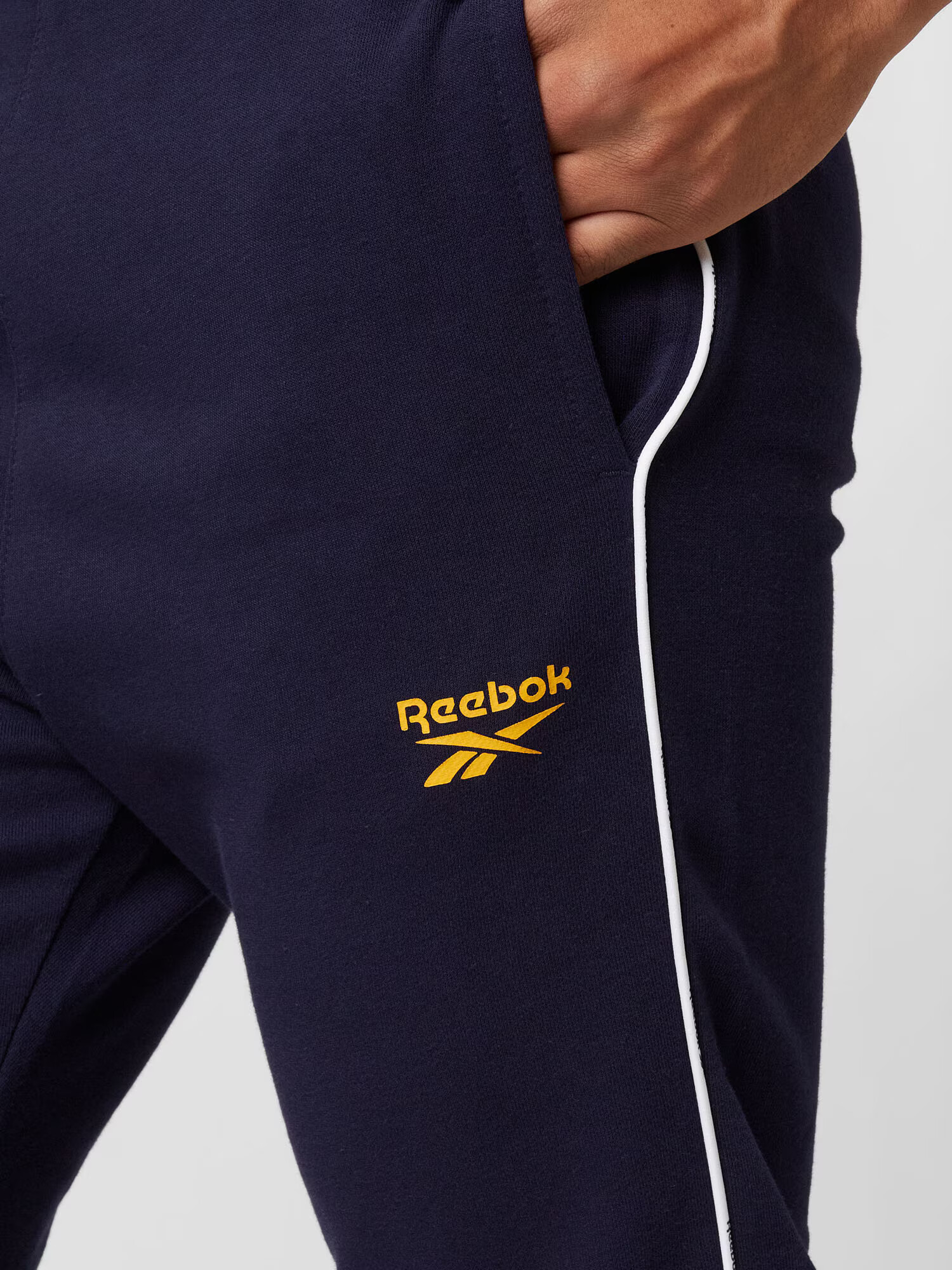 Reebok Sport Pantaloni sport bleumarin / galben închis / alb - Pled.ro