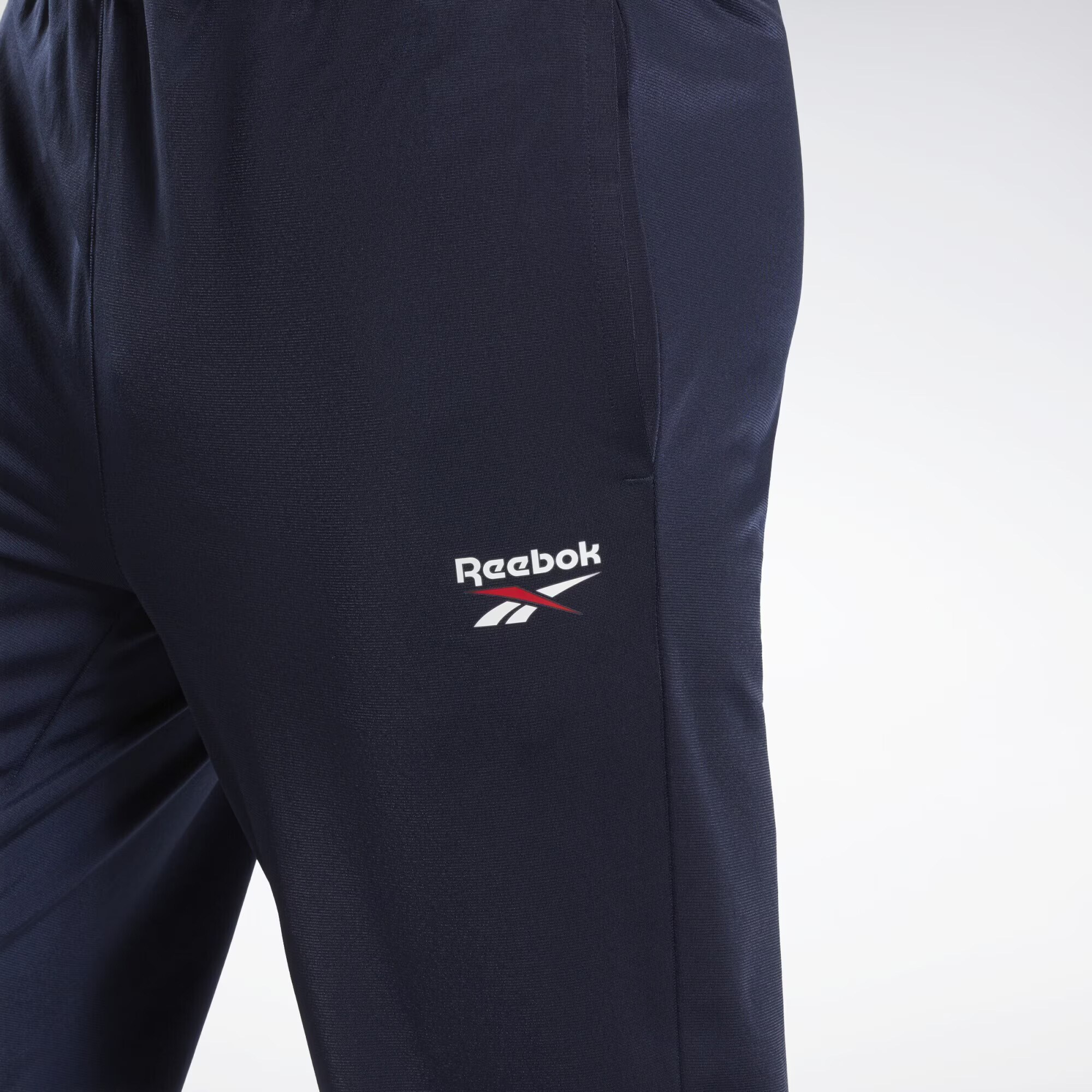 Reebok Pantaloni sport bleumarin / roșu cireș / alb - Pled.ro