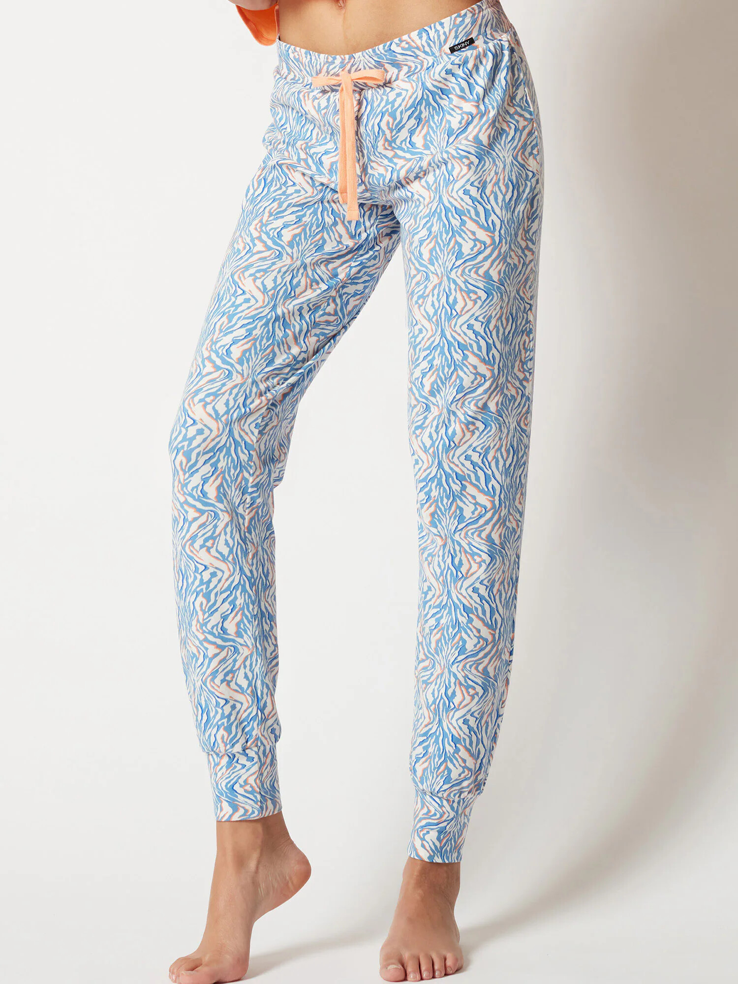 Skiny Pantaloni de pijama albastru deschis / portocaliu somon / alb murdar - Pled.ro