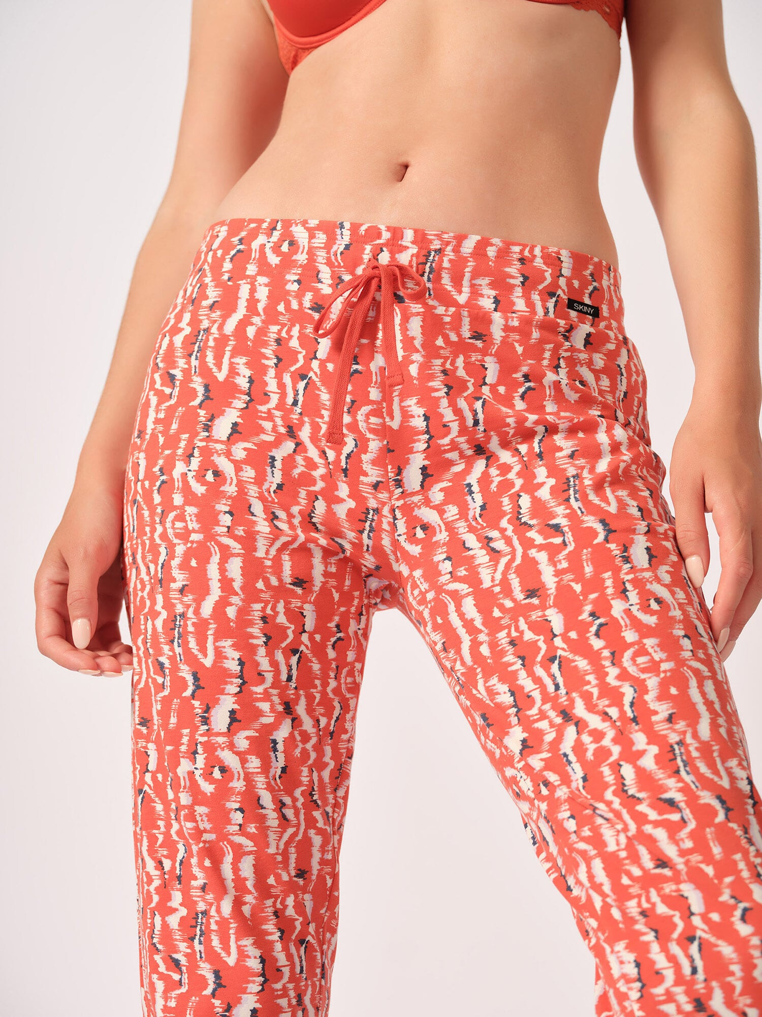 Skiny Pantaloni de pijama portocaliu / negru / alb - Pled.ro