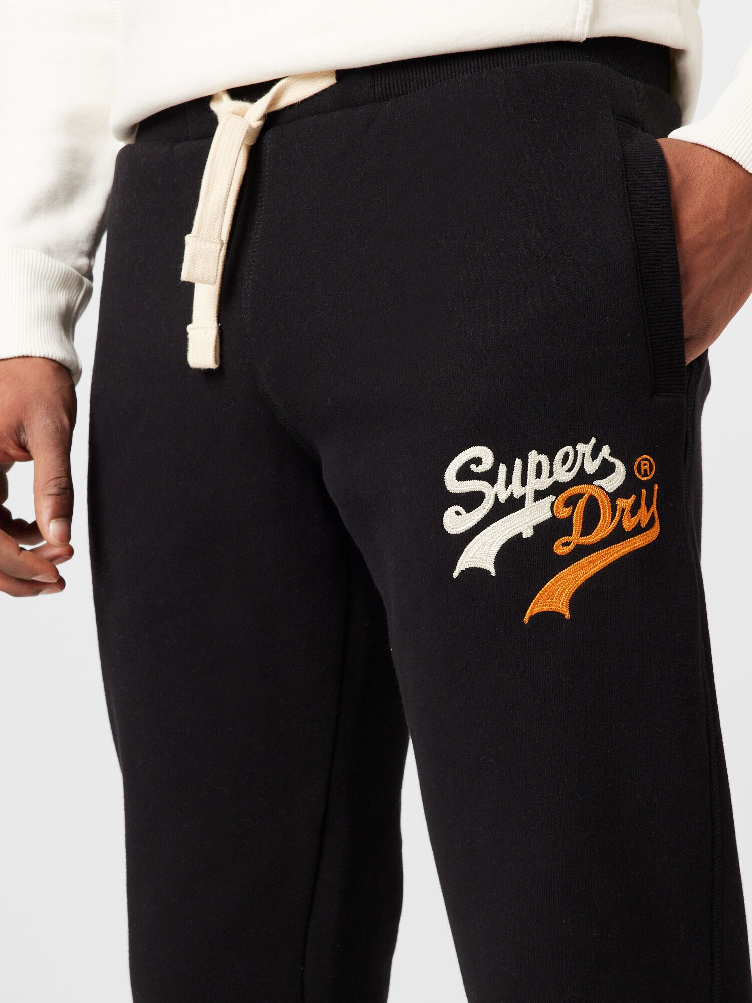 Superdry Pantaloni portocaliu / negru / alb - Pled.ro