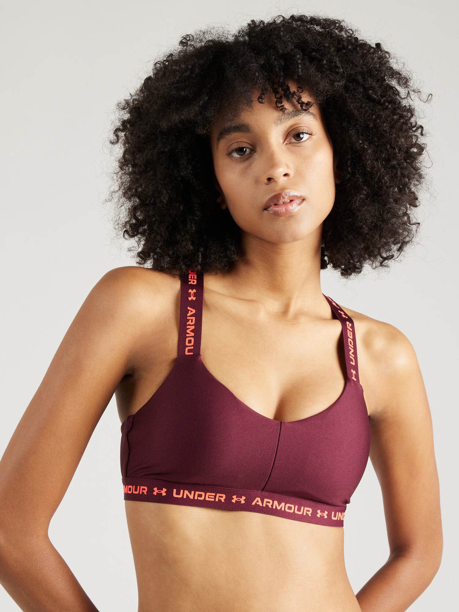 UNDER ARMOUR Sutien sport portocaliu piersică / roșu bordeaux - Pled.ro