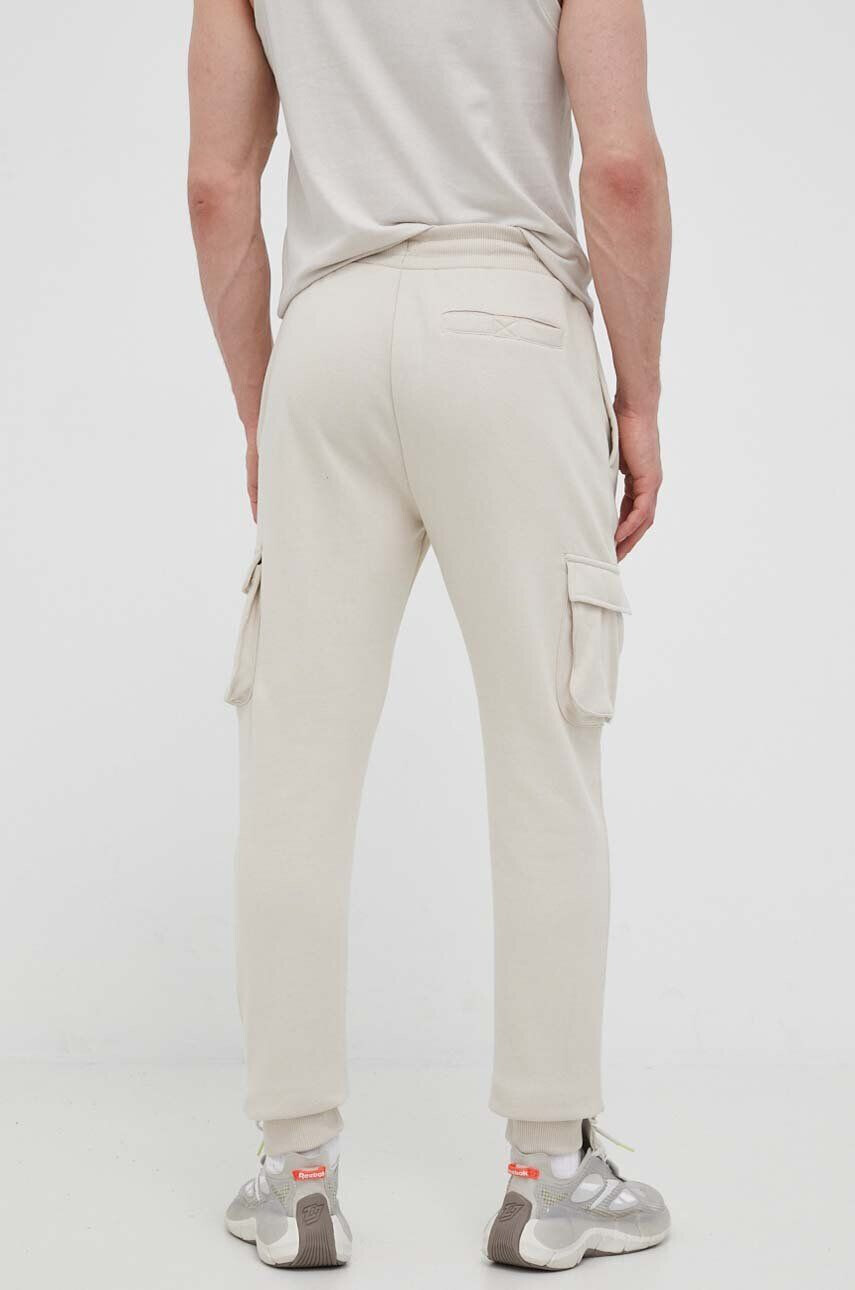 Ellesse pantaloni de trening culoarea bej cu imprimeu - Pled.ro