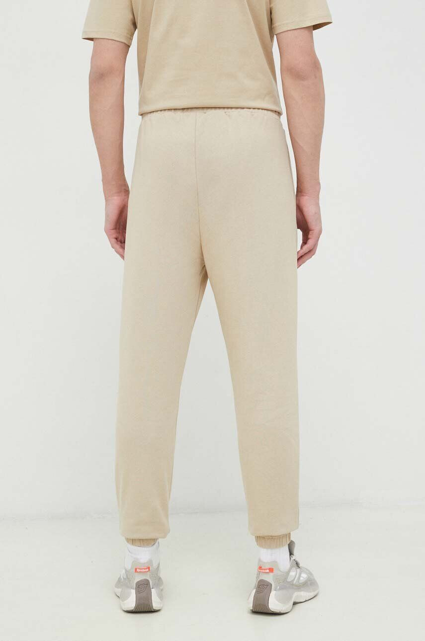 Fila pantaloni de trening din bumbac culoarea bej neted - Pled.ro