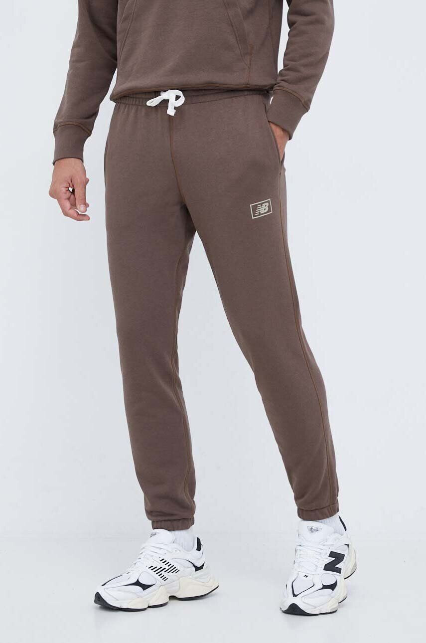 New Balance pantaloni de trening culoarea maro neted - Pled.ro