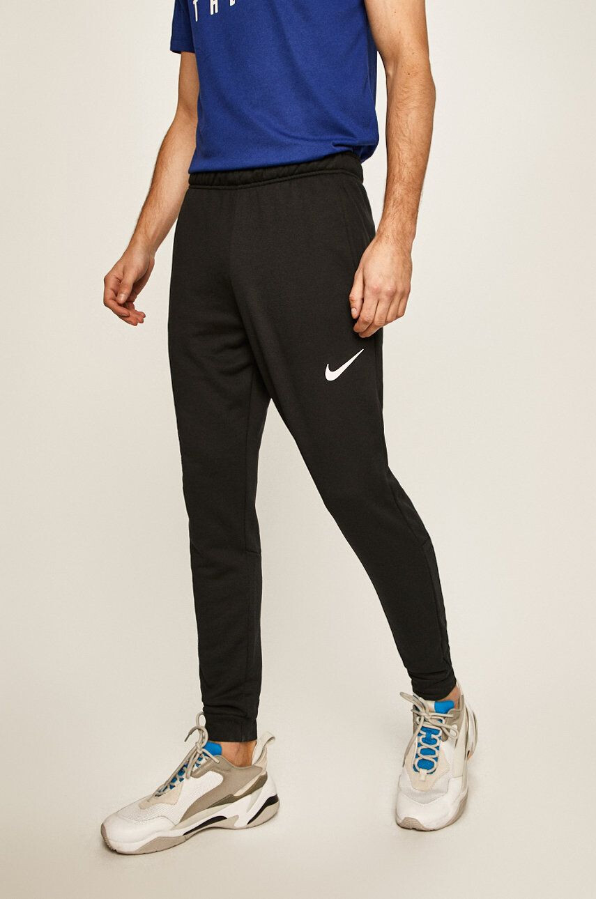 Nike Pantaloni - Pled.ro