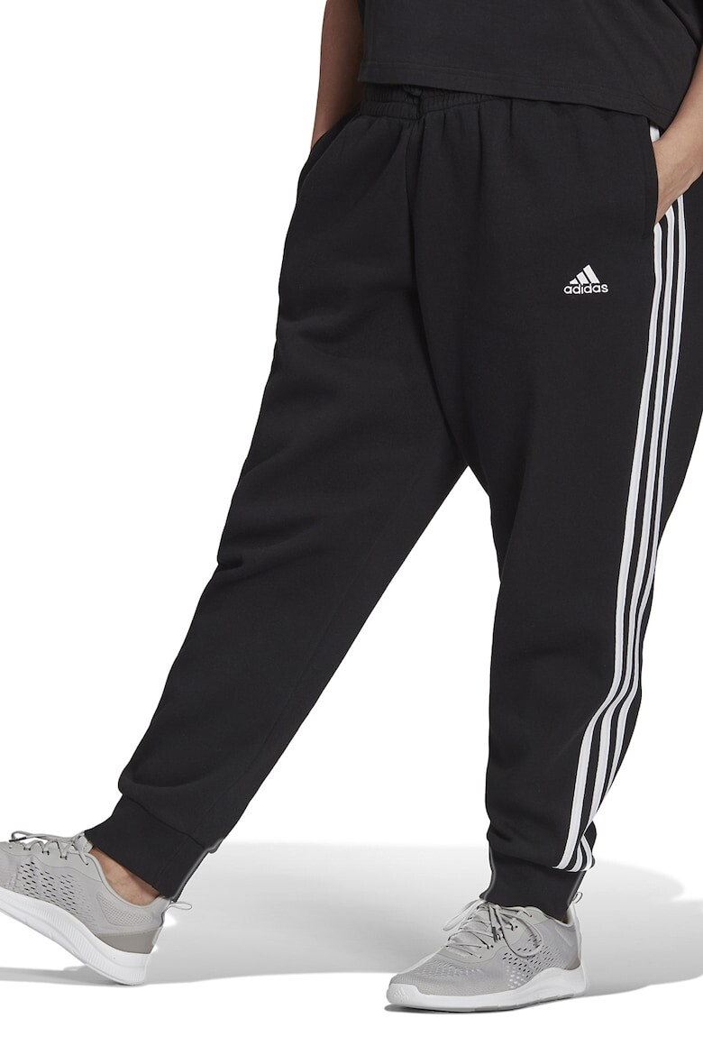 adidas Sportswear Pantaloni sport slim fit cu croiala conica si 3 dungi Essentials - Pled.ro