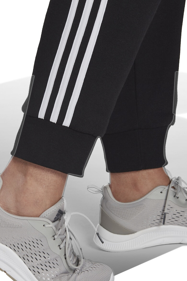 adidas Sportswear Pantaloni sport slim fit cu croiala conica si 3 dungi Essentials - Pled.ro