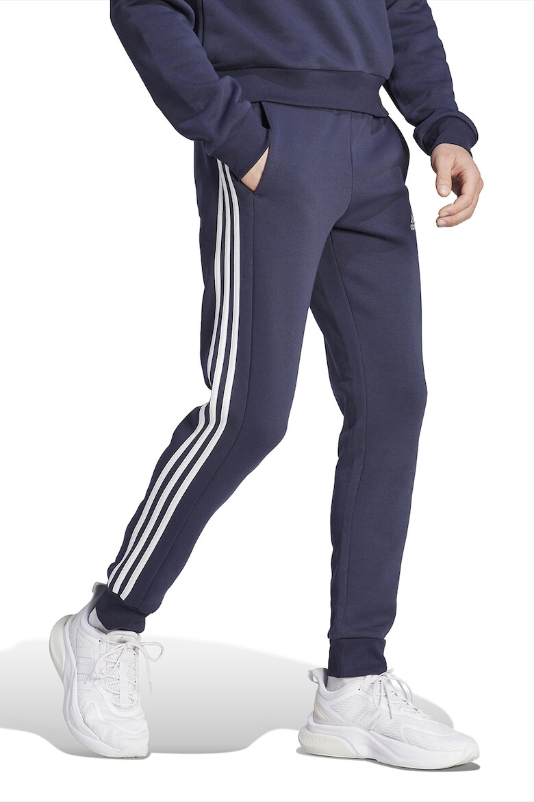 adidas Sportswear Pantaloni de trening conici cu buzunare laterale - Pled.ro