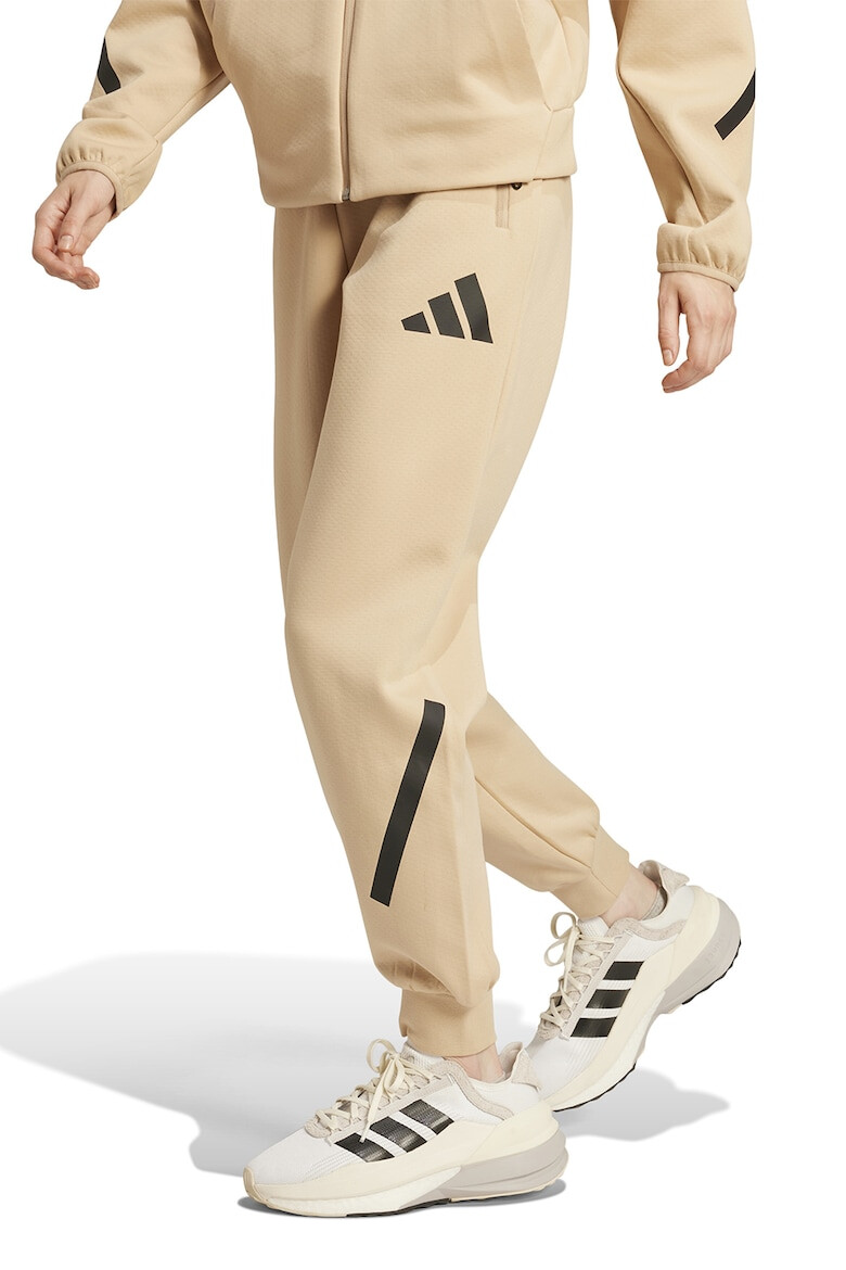 adidas Sportswear Pantaloni de trening cu buzunare cu fermoar si snur Z.N.E. - Pled.ro