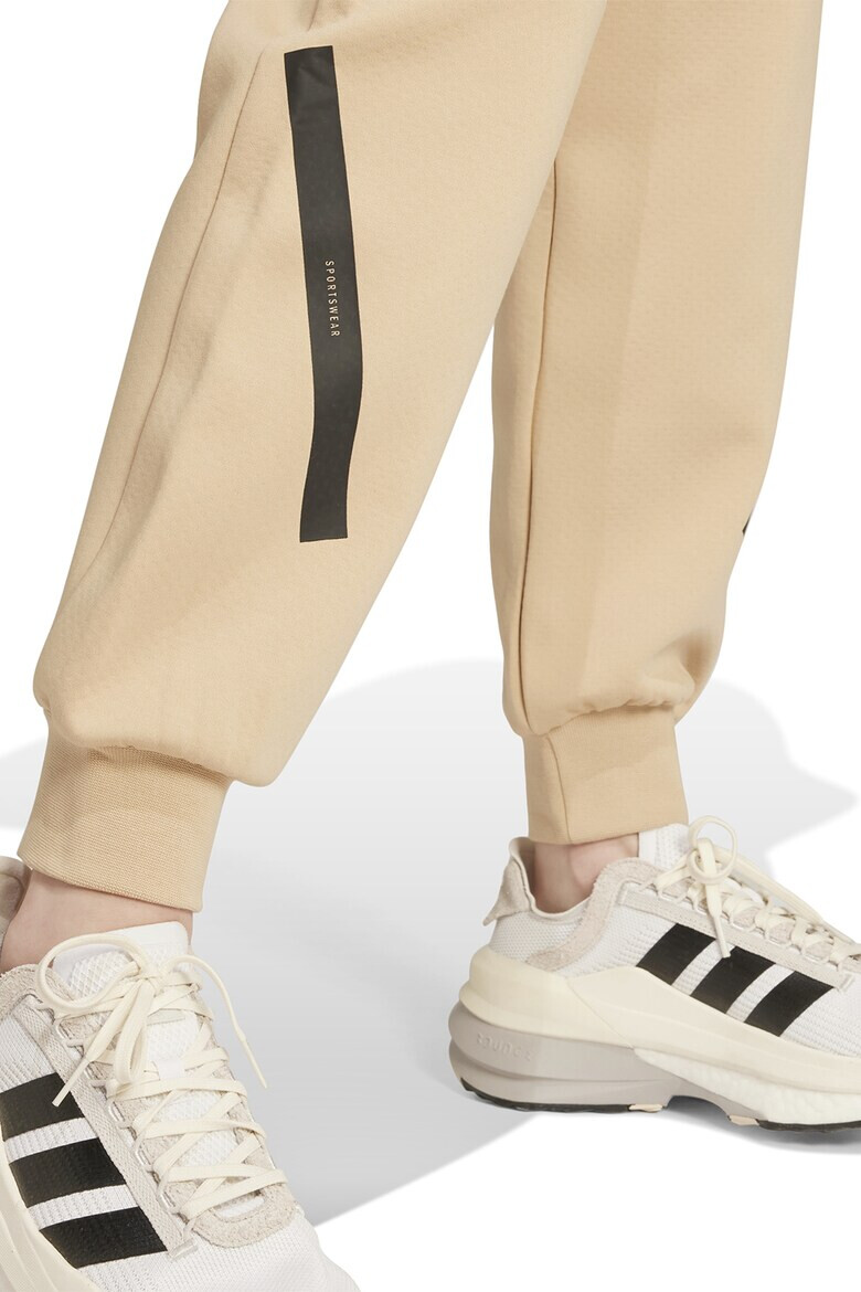 adidas Sportswear Pantaloni de trening cu buzunare cu fermoar si snur Z.N.E. - Pled.ro