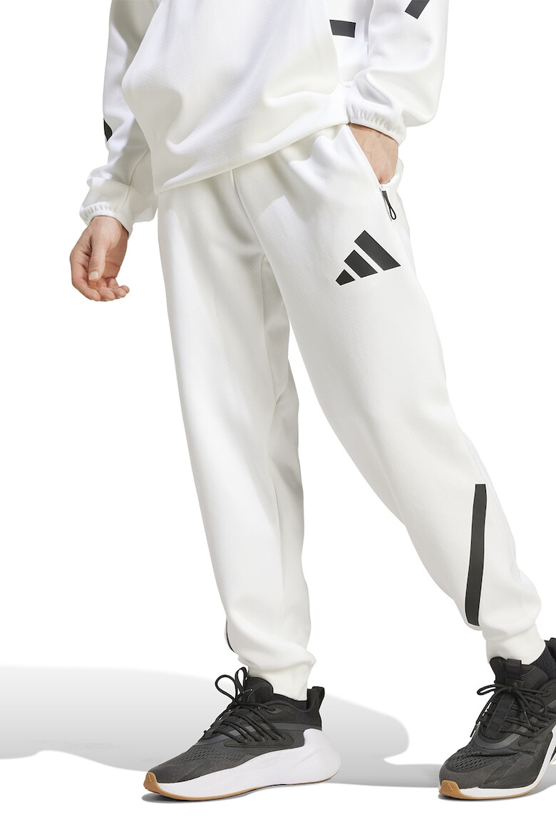 adidas Sportswear Pantaloni de trening cu buzunare cu fermoar Z.N.E. - Pled.ro